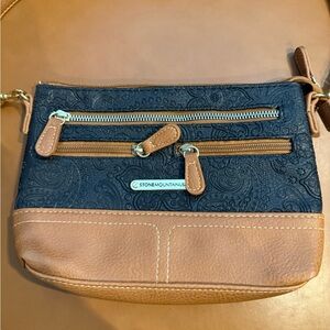 Stone Mountain Accessories Black and Tan Crossbody Bag with Embossed Design
